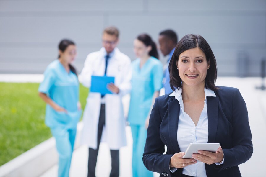 female doctor holding tablet