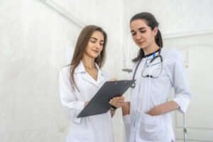 Smiling doctors young and confident posing in hospital for camera